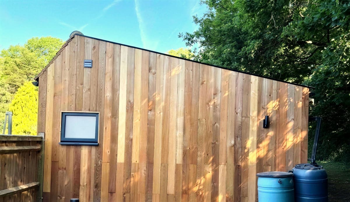 Cedar cladding on the side of the converted barn