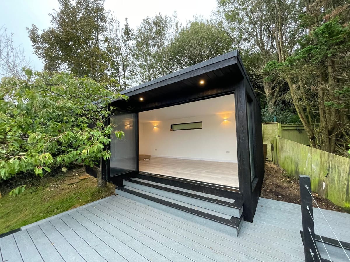 Garden office with 3m bi-fold doors open onto the deck