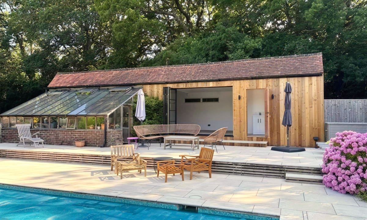 Cedar-clad barn conversion beside a swimming pool, Haywards Heath