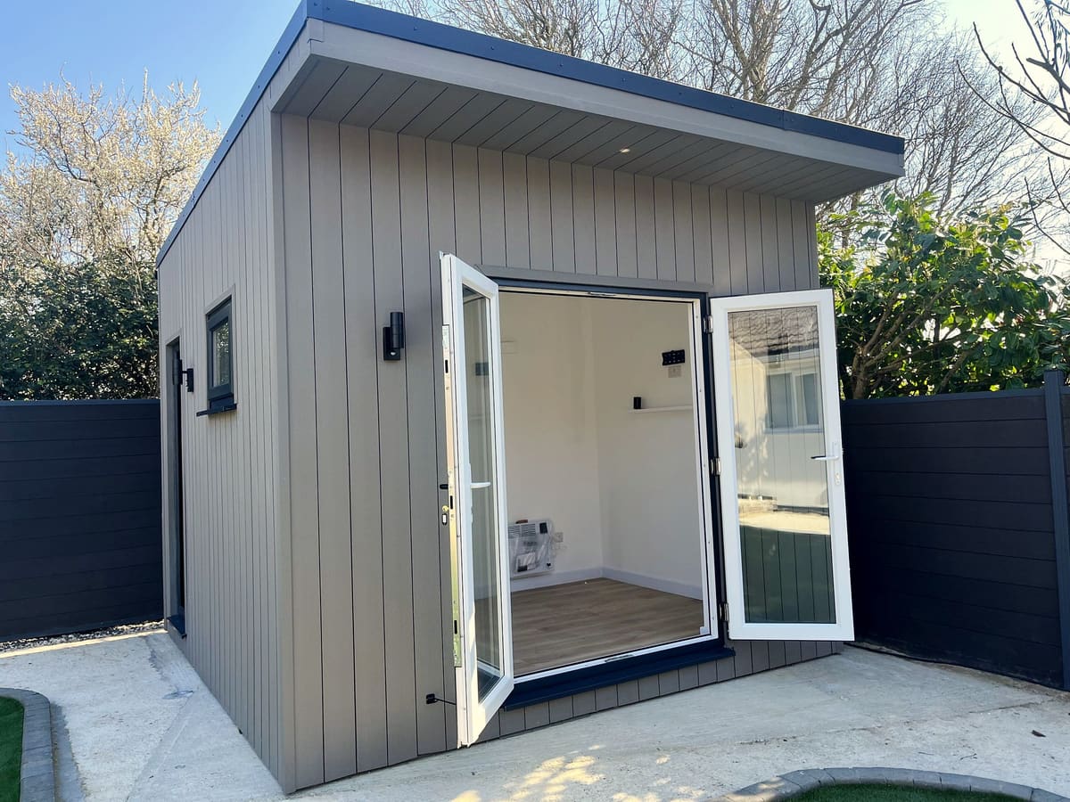 Grey composite-clad home gym garden room, East Sussex