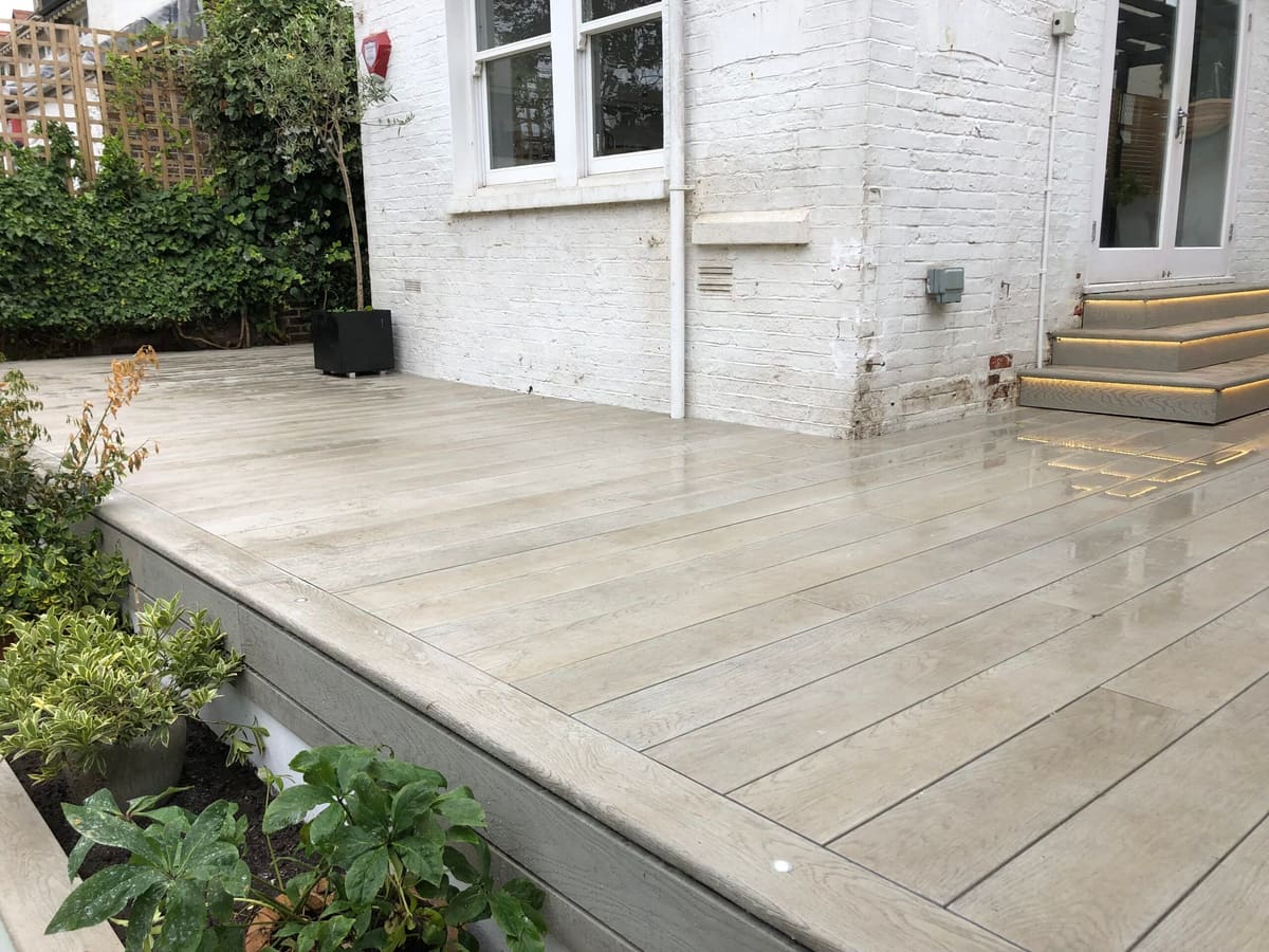 Porcelain-paved patio and steps outside a house